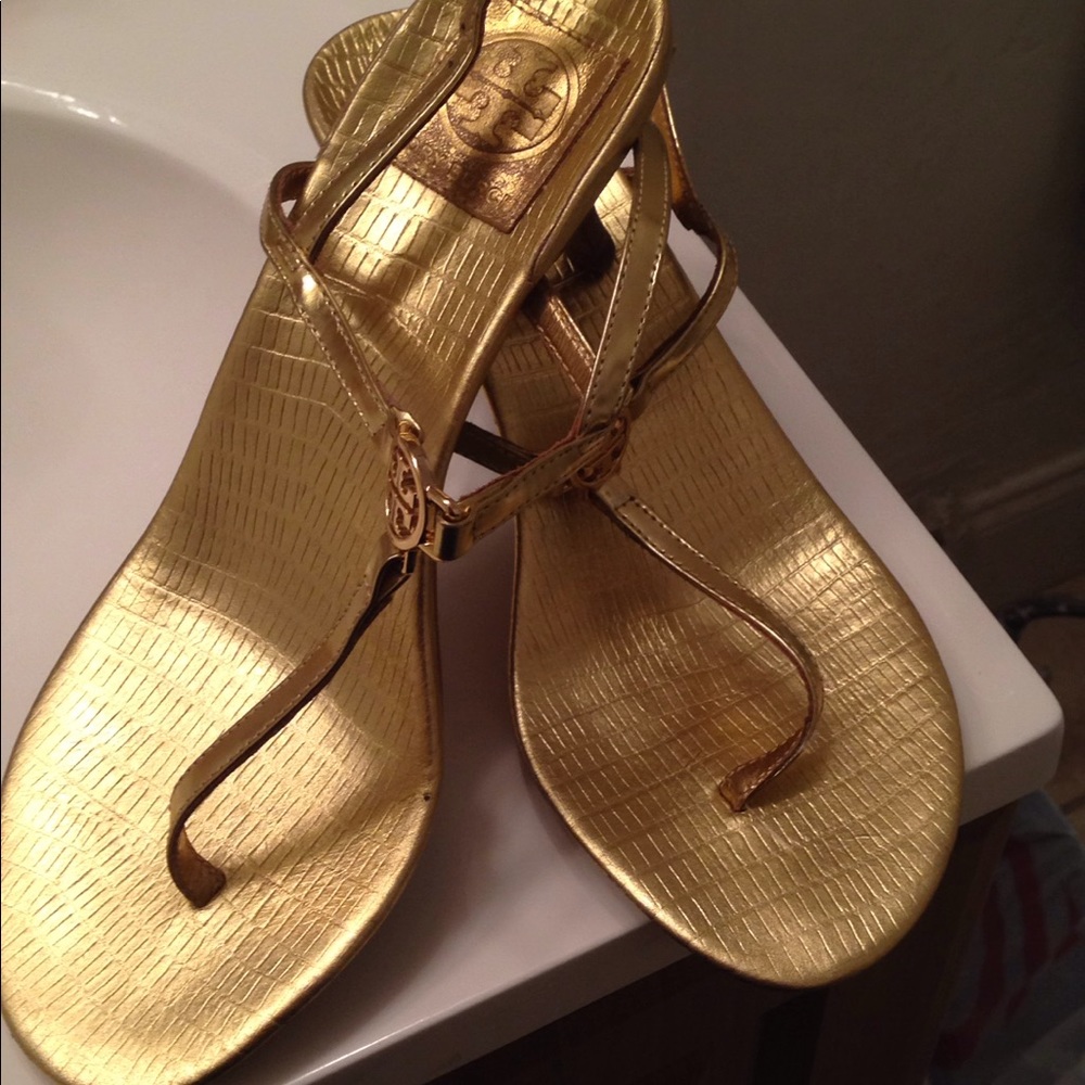 Gold Tory sandals.